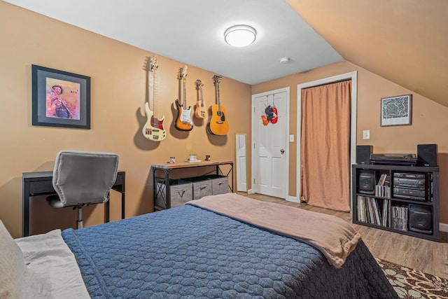 11 Beauchesne Dr, Hooksett, NH 03106 - bedroom with wood finished floors, vaulted ceiling, and baseboards