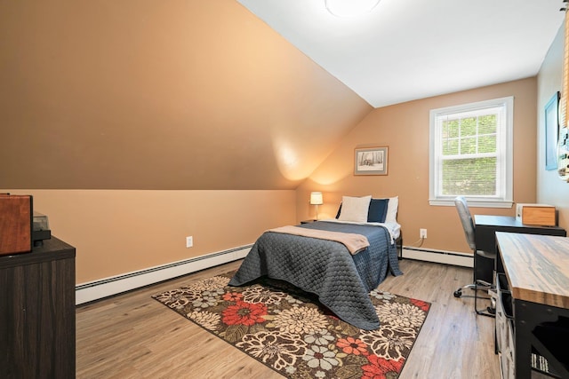 11 Beauchesne Dr, Hooksett, NH 03106 - bedroom with a baseboard radiator, light wood-style floors, and vaulted ceiling