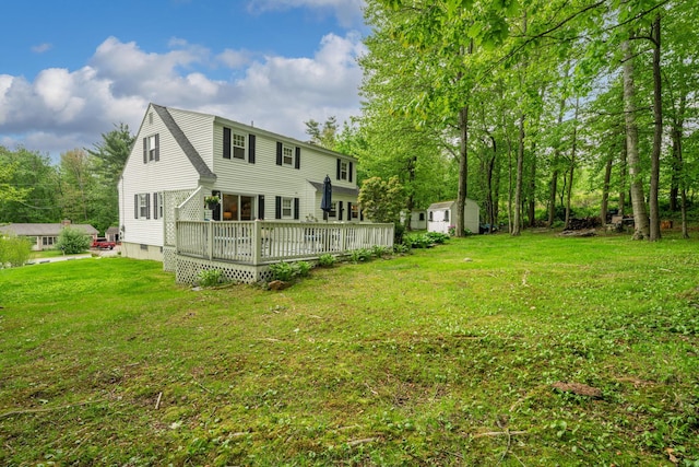 11 Beauchesne Dr, Hooksett, NH 03106 - rear view of property featuring a wooden deck and a yard