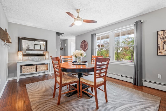 11 Beauchesne Dr, Hooksett, NH 03106 - dining room with wood finished floors, a ceiling fan, a textured ceiling, baseboards, and baseboard heating
