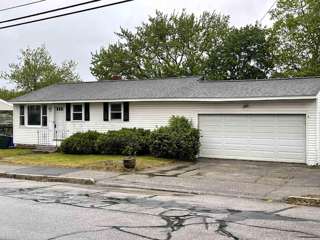 82 S Jewett St, Manchester, NH 03103 - single story home with driveway, an attached garage, and roof with shingles