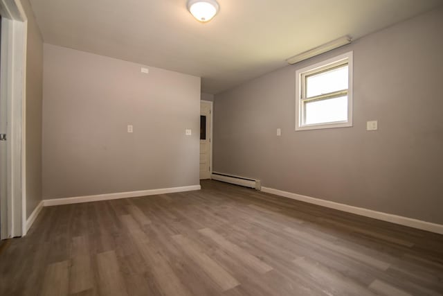 82 S Jewett St, Manchester, NH 03103 - unfurnished room featuring a baseboard radiator and baseboards