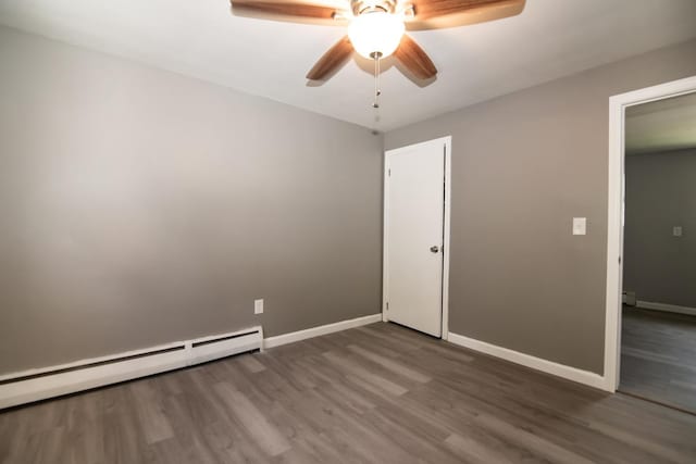 82 S Jewett St, Manchester, NH 03103 - unfurnished bedroom featuring baseboard heating, wood finished floors, baseboards, and a ceiling fan