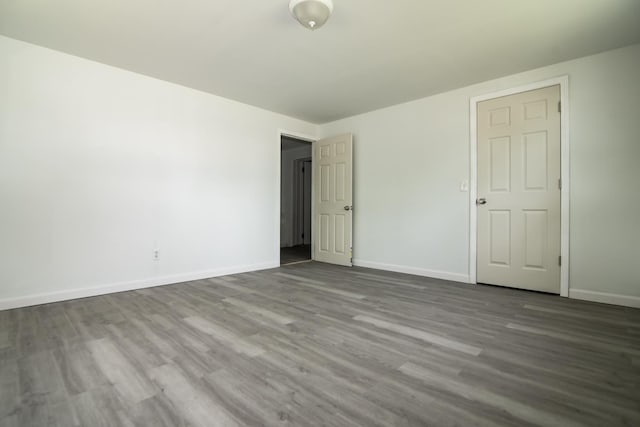 82 S Jewett St, Manchester, NH 03103 - empty room featuring baseboards and wood finished floors