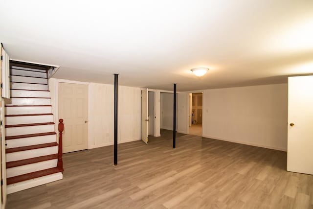 82 S Jewett St, Manchester, NH 03103 - finished below grade area with light wood finished floors, stairs, and baseboards