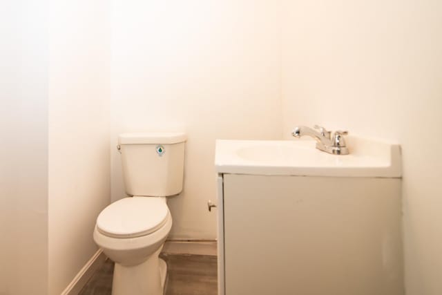 82 S Jewett St, Manchester, NH 03103 - bathroom featuring vanity, toilet, and wood finished floors