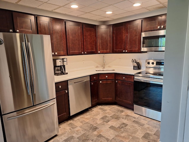 137 E Mountain Rd Unit 2C1, Killington, VT 05751 - kitchen with appliances with stainless steel finishes, a sink, light countertops, dark brown cabinetry, and backsplash