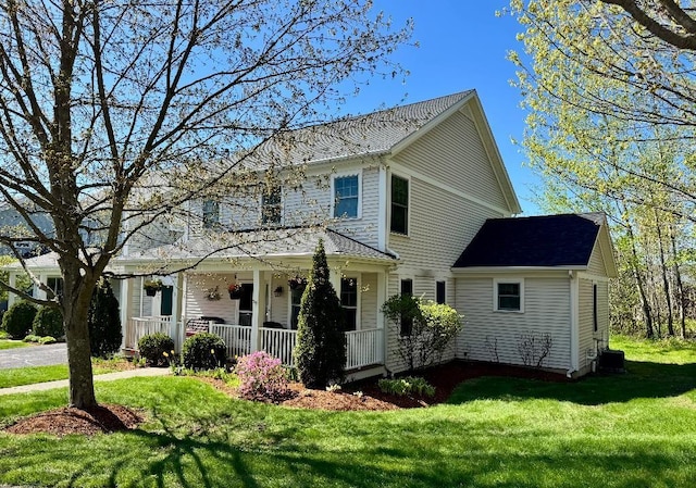1 Stannard Dr, Essex, VT 05452 - view of front of property with covered porch, a front lawn, and central air condition unit