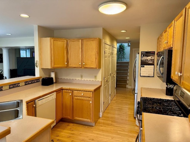 1 Stannard Dr, Essex, VT 05452 - kitchen with appliances with stainless steel finishes, light wood-style floors, light countertops, a sink, and recessed lighting