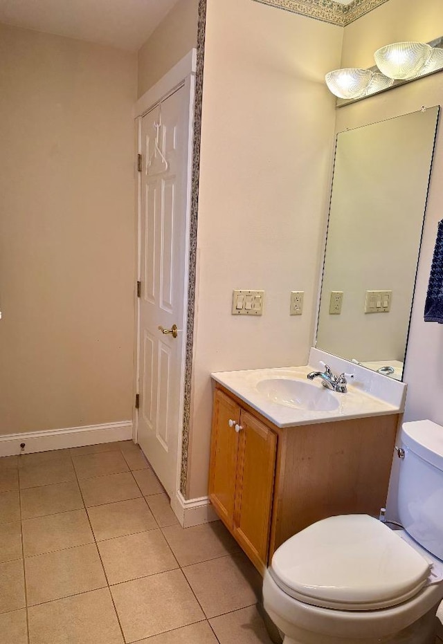 1 Stannard Dr, Essex, VT 05452 - bathroom featuring toilet, vanity, tile patterned flooring, baseboards, and a closet