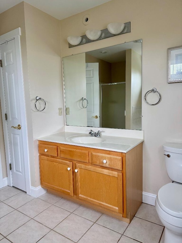 1 Stannard Dr, Essex, VT 05452 - full bath with tile patterned flooring, toilet, vanity, a stall shower, and baseboards
