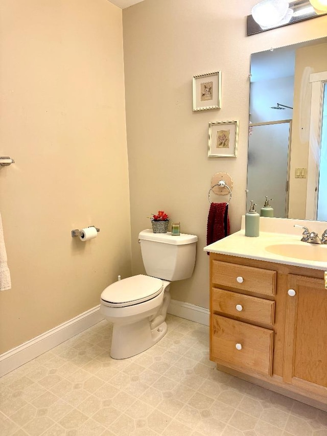 1 Stannard Dr, Essex, VT 05452 - bathroom featuring baseboards, toilet, and vanity