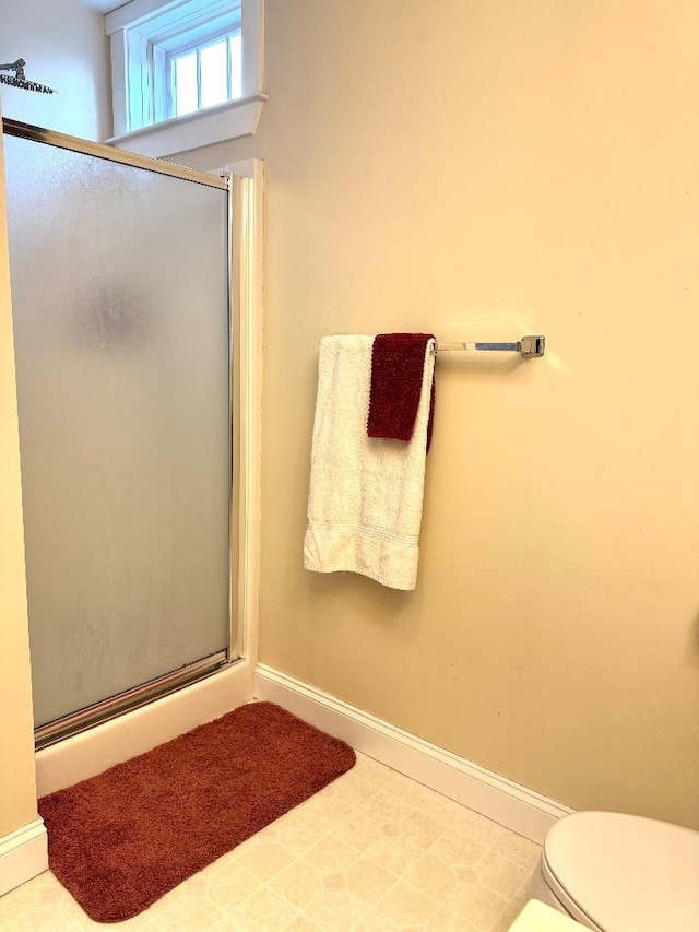 1 Stannard Dr, Essex, VT 05452 - full bathroom featuring a shower stall, baseboards, and toilet