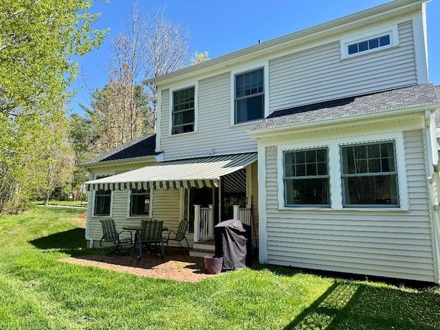 1 Stannard Dr, Essex, VT 05452 - rear view of property featuring a lawn