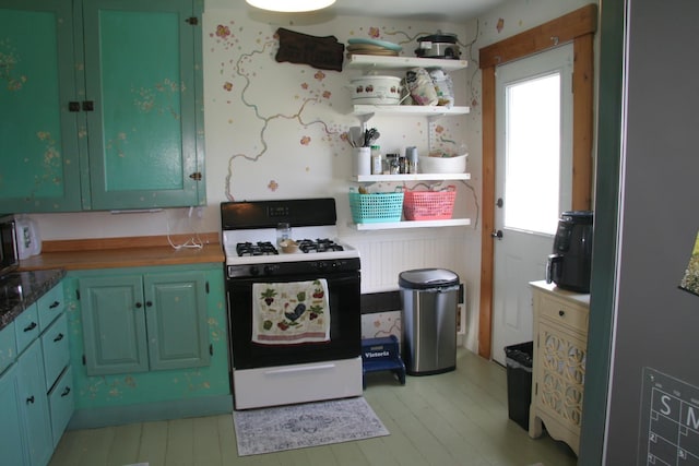 2884 Tampico Rd, Danville, VT 05828 - kitchen featuring gas range oven and light wood-style flooring