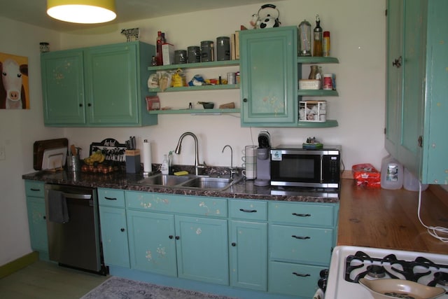 2884 Tampico Rd, Danville, VT 05828 - kitchen featuring open shelves, appliances with stainless steel finishes, a sink, and light wood finished floors