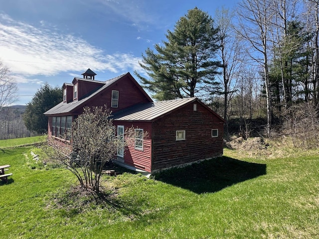 2884 Tampico Rd, Danville, VT 05828 - view of side of property with a yard, metal roof, and a standing seam roof