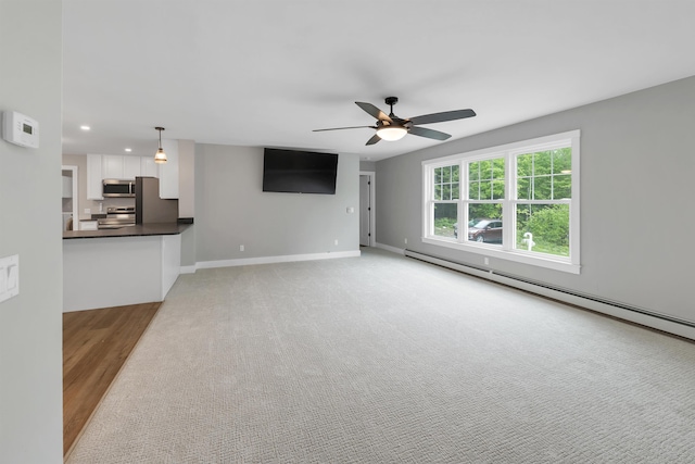 10 Call Rd, Webster, NH 03303 - unfurnished living room with a baseboard radiator, ceiling fan, baseboards, recessed lighting, and light wood finished floors