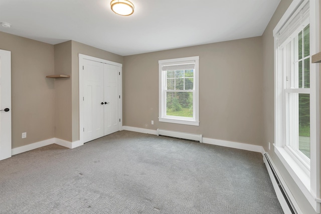 10 Call Rd, Webster, NH 03303 - unfurnished bedroom featuring a baseboard radiator, baseboards, carpet floors, and a closet