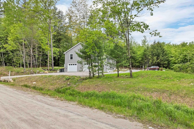 10 Call Rd, Webster, NH 03303 - view of side of property featuring an attached garage, driveway, and a wooded view