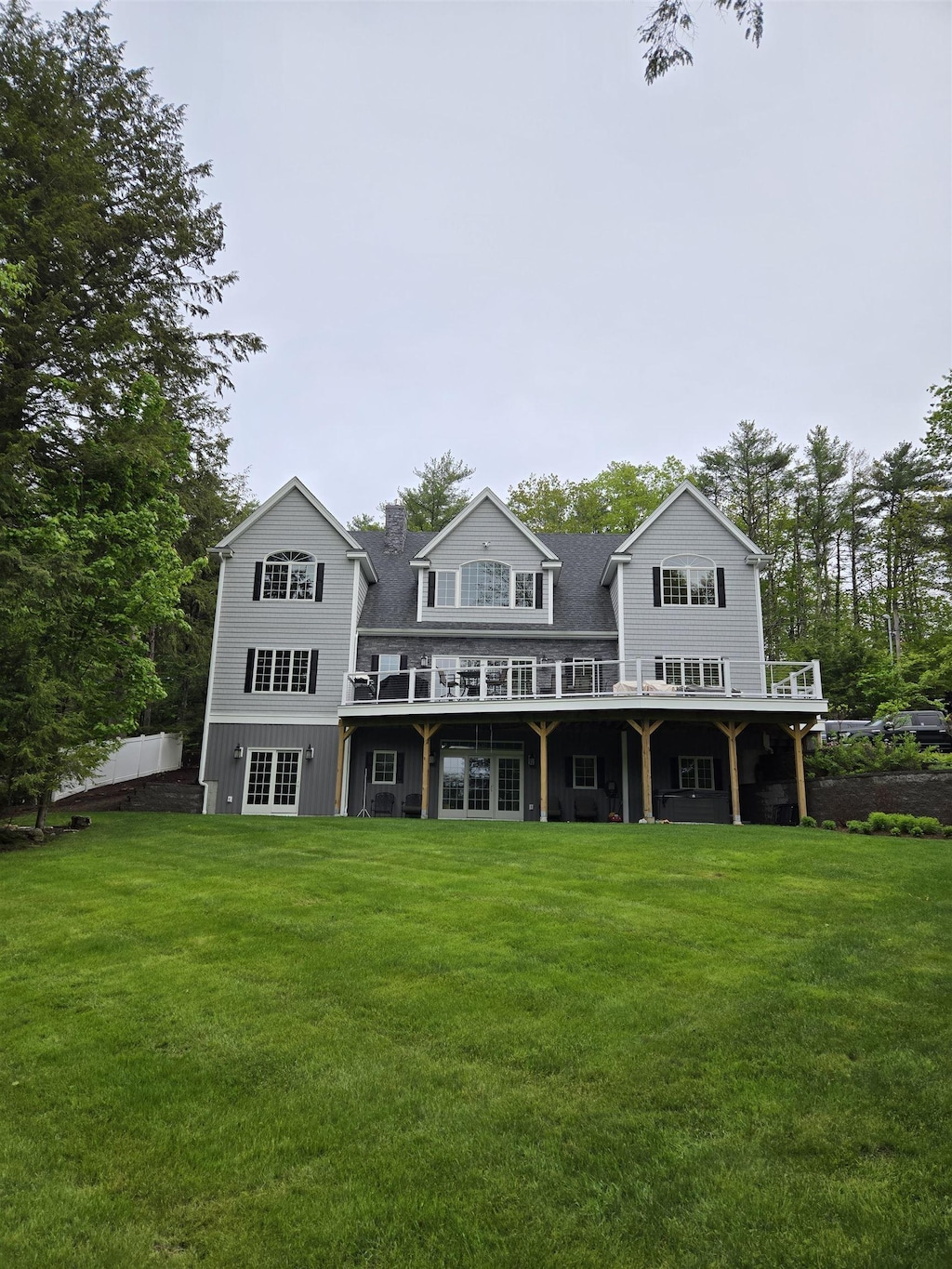 11 Quimby Rd, Meredith, NH 03253 - back of house with a lawn and a deck