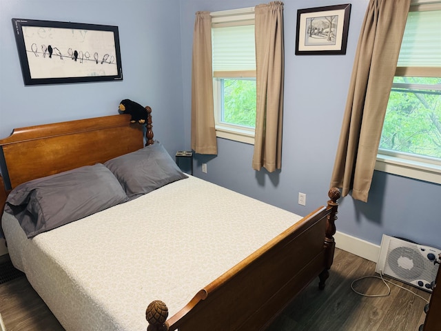 1334 Back Center Rd, Lyndon, VT 05851 - bedroom featuring dark wood-type flooring, multiple windows, and baseboards