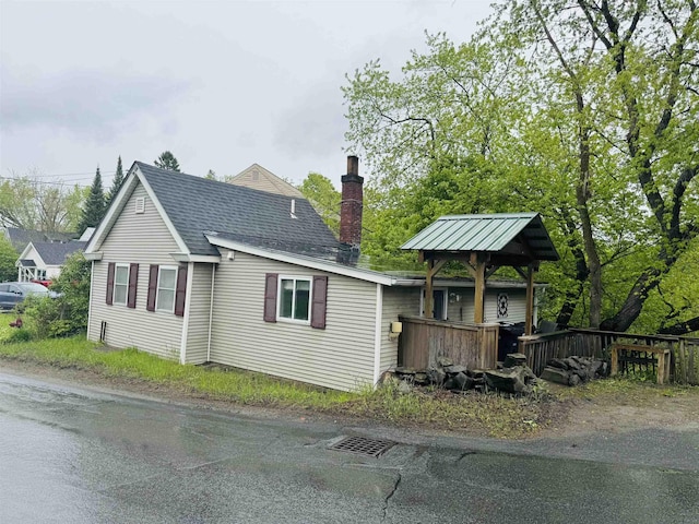 1334 Back Center Rd, Lyndon, VT 05851 - view of front facade featuring a chimney and a shingled roof