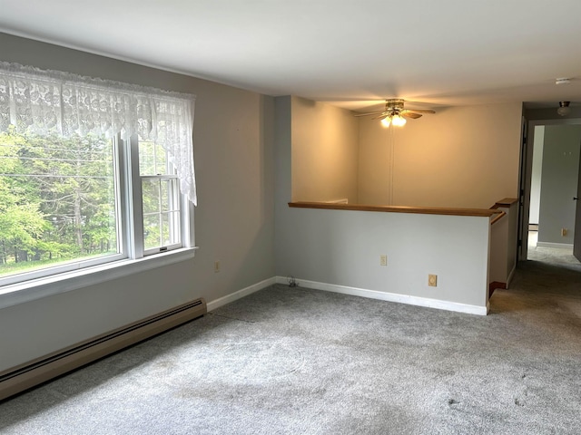 34 Hampshire Cir, Brattleboro, VT 05301 - spare room featuring baseboard heating, carpet flooring, a ceiling fan, and baseboards