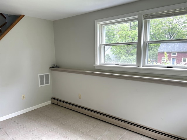 34 Hampshire Cir, Brattleboro, VT 05301 - spare room featuring a baseboard radiator, baseboards, and light tile patterned floors
