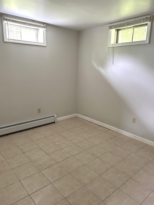 34 Hampshire Cir, Brattleboro, VT 05301 - unfurnished room with a baseboard heating unit and light tile patterned floors