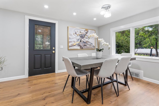 65 Sanborn St, Laconia, NH 03246 - dining room featuring baseboards, light wood-style floors, recessed lighting, and a chandelier