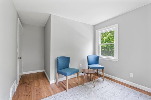 65 Sanborn St, Laconia, NH 03246 - living area with wood finished floors and baseboards