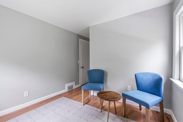 65 Sanborn St, Laconia, NH 03246 - sitting room with wood finished floors and baseboards