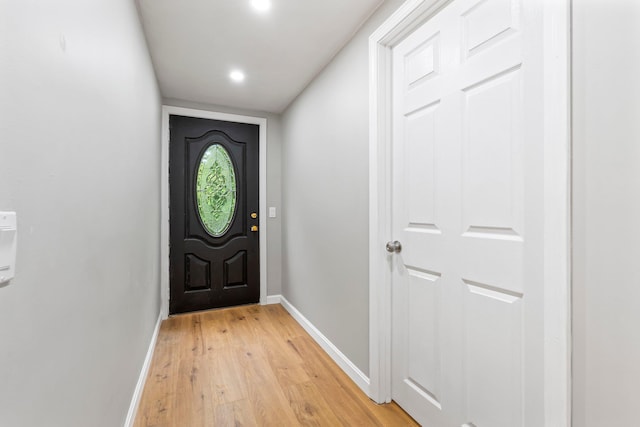 65 Sanborn St, Laconia, NH 03246 - doorway to outside with baseboards, light wood-style floors, and recessed lighting