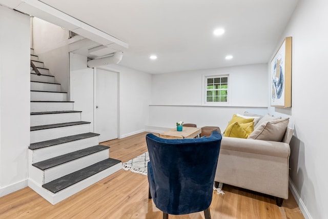 65 Sanborn St, Laconia, NH 03246 - living area with light wood-type flooring, recessed lighting, stairs, and baseboards