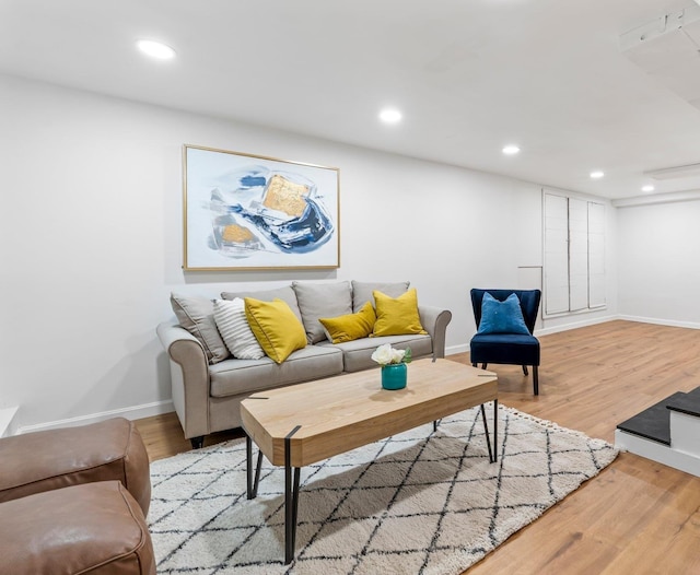 65 Sanborn St, Laconia, NH 03246 - living room featuring baseboards, wood finished floors, and recessed lighting