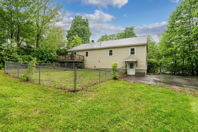 65 Sanborn St, Laconia, NH 03246 - rear view of house featuring a deck and metal roof