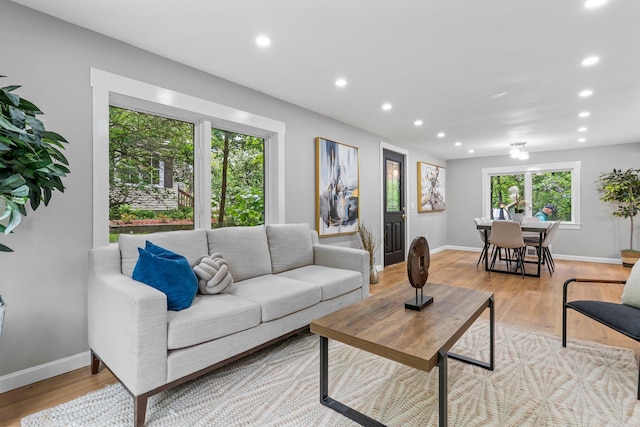 65 Sanborn St, Laconia, NH 03246 - living area featuring recessed lighting, light wood-style floors, and baseboards