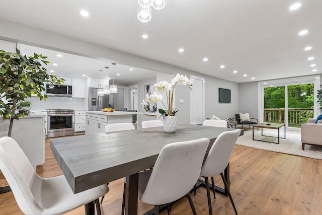 65 Sanborn St, Laconia, NH 03246 - dining space with recessed lighting, light wood finished floors, and a chandelier