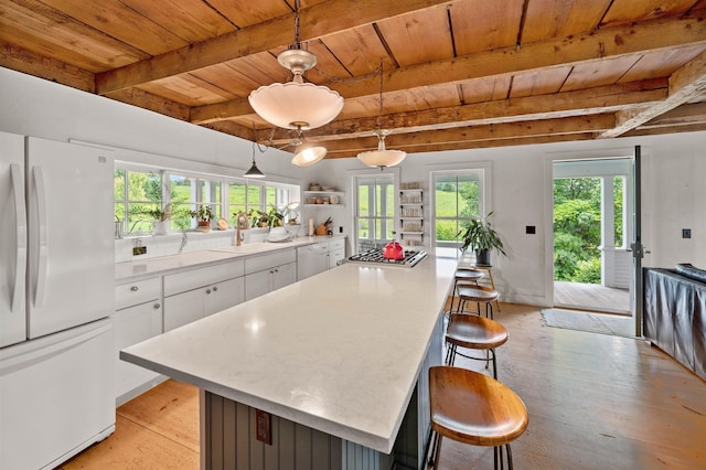 2192 Jack Hill Rd, Calais, VT 05650 - kitchen featuring white appliances, wooden ceiling with exposed beams, a sink, white cabinets, and light countertops