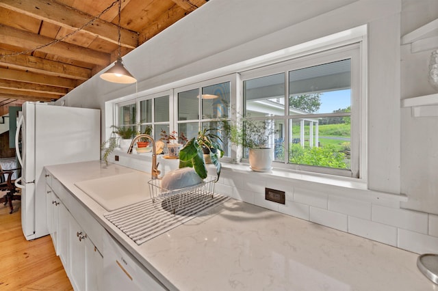 2192 Jack Hill Rd, Calais, VT 05650 - kitchen with wood ceiling with exposed beams, freestanding refrigerator, white cabinets, decorative light fixtures, and tasteful backsplash