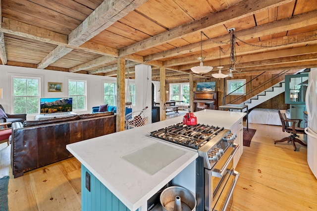 2192 Jack Hill Rd, Calais, VT 05650 - kitchen featuring double oven range, wood ceiling with exposed beams, open floor plan, light wood-type flooring, and healthy amount of natural light