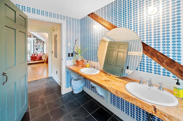 2192 Jack Hill Rd, Calais, VT 05650 - bathroom with tile patterned flooring, wallpapered walls, baseboards, and double vanity