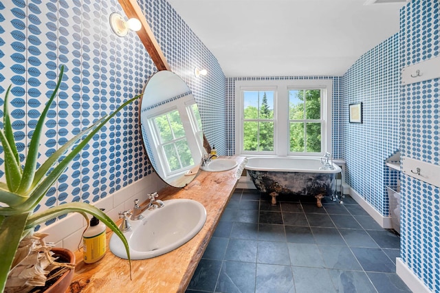2192 Jack Hill Rd, Calais, VT 05650 - full bath featuring wallpapered walls, a soaking tub, plenty of natural light, double vanity, and baseboards