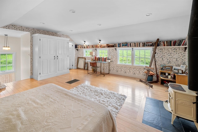 2192 Jack Hill Rd, Calais, VT 05650 - bedroom with wallpapered walls, vaulted ceiling, and light wood-type flooring