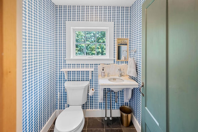 2192 Jack Hill Rd, Calais, VT 05650 - bathroom featuring toilet, baseboards, wallpapered walls, a sink, and tile patterned floors