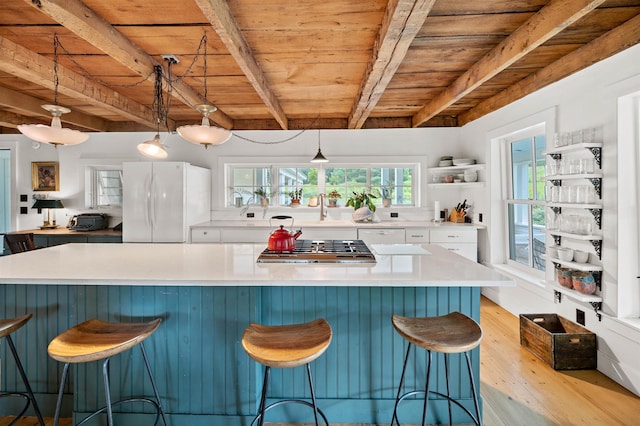 2192 Jack Hill Rd, Calais, VT 05650 - kitchen featuring freestanding refrigerator, white cabinetry, light wood-type flooring, wood ceiling with exposed beams, and stainless steel gas stovetop