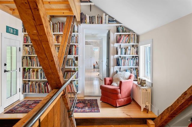 2192 Jack Hill Rd, Calais, VT 05650 - sitting room featuring healthy amount of natural light, radiator, vaulted ceiling, and wood finished floors