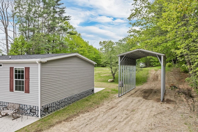29 Stoneham Rd Unit 4, Wakefield, NH 03872 - view of outbuilding featuring a detached carport and driveway