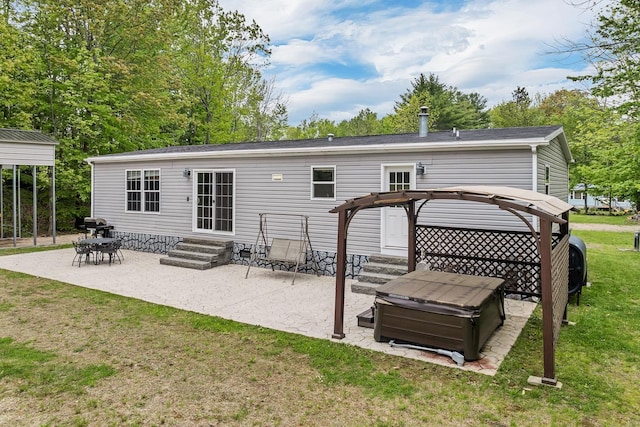 29 Stoneham Rd Unit 4, Wakefield, NH 03872 - rear view of property with entry steps, a lawn, and a patio area